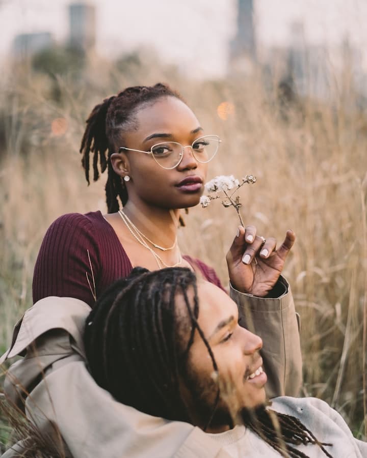 A couple sitting together in warm evening light